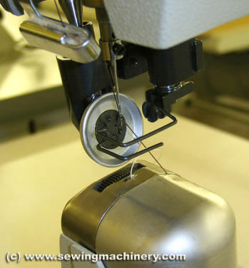 Roller feed post bed sewing machine